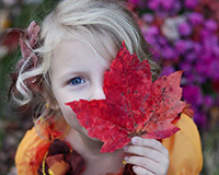 Little Girl holding a leaf