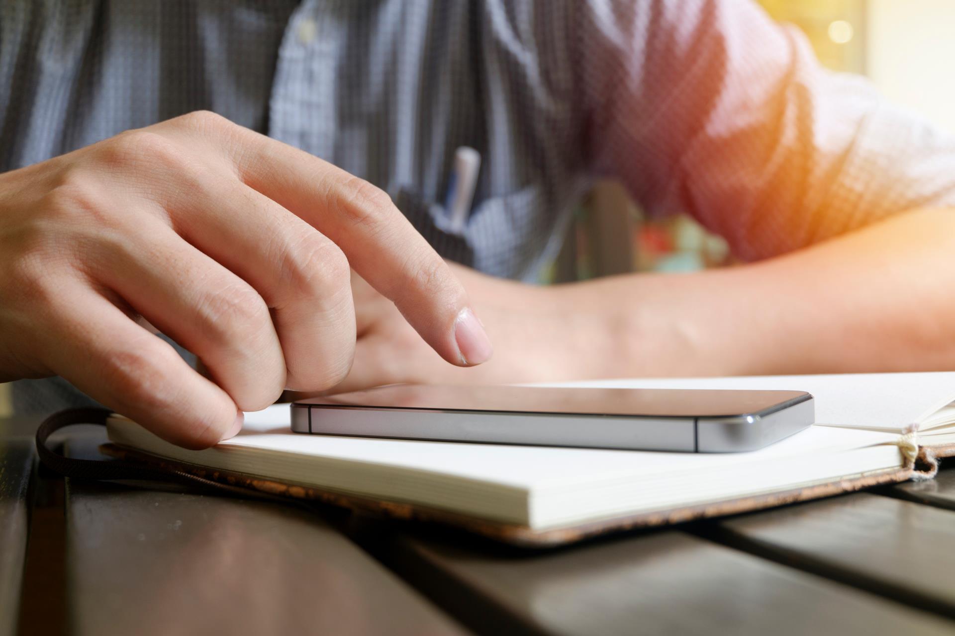 Man typing on phone